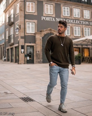 Dark Brown Crew-neck Sweater Outfits For Men: A dark brown crew-neck sweater and light blue skinny jeans are amazing menswear must-haves that will integrate brilliantly within your day-to-day styling routine. Want to dial it down with footwear? Add grey athletic shoes to the equation for the day.
