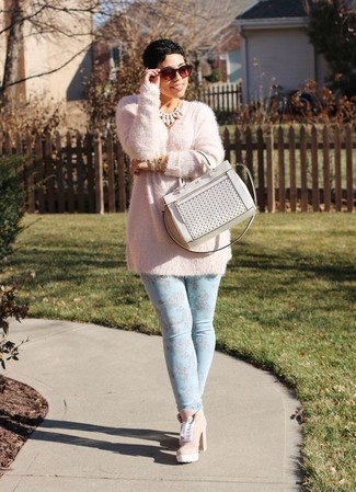 Pink Fluffy Crew-neck Sweater Outfits For Women: This pairing of a pink fluffy crew-neck sweater and light blue floral skinny jeans offers comfort and efficiency and helps keep it simple yet current. You could perhaps get a bit experimental on the shoe front and class up this getup with a pair of pink suede lace-up ankle boots.