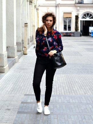 Black Leather Bucket Bag Outfits: A navy floral crew-neck sweater and a black leather bucket bag are the perfect way to introduce some cool into your off-duty arsenal. Give your getup an element of refinement by sporting white low top sneakers.
