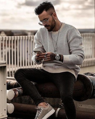 Beige Suede Low Top Sneakers Outfits For Men: A grey crew-neck sweater and charcoal skinny jeans have become a go-to pairing for many fashion-savvy gents. Add a pair of beige suede low top sneakers to this look and the whole getup will come together.