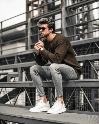 Grey Ripped Skinny Jeans Outfits For Men: To assemble an off-duty menswear style with a contemporary finish, wear a dark brown crew-neck sweater and grey ripped skinny jeans. A pair of white leather low top sneakers will create a beautiful contrast against the rest of the outfit.