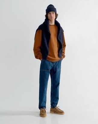 Dark Brown Sweatshirt Outfits For Men: This laid-back pairing of a dark brown sweatshirt and navy jeans is extremely easy to pull together without a second thought, helping you look on-trend and ready for anything without spending too much time combing through your wardrobe. Let your styling skills truly shine by rounding off this look with brown suede desert boots.