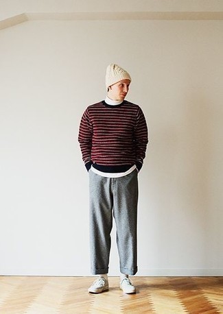 Grey Canvas Low Top Sneakers Outfits For Men: Why not reach for a burgundy horizontal striped crew-neck sweater and grey chinos? As well as very comfortable, these two items look amazing when paired together. Let your styling chops truly shine by rounding off your getup with grey canvas low top sneakers.