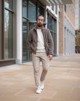 Dark Brown Fleece Zip Sweater Outfits For Men: This combo of a dark brown fleece zip sweater and beige chinos is definitive proof that a safe casual outfit can still be really interesting. White athletic shoes will bring a dose of stylish casualness to an otherwise classic outfit.