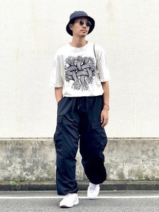 Men's White and Black Print Crew-neck T-shirt, Navy Cargo Pants, White Athletic Shoes, Navy Bucket Hat