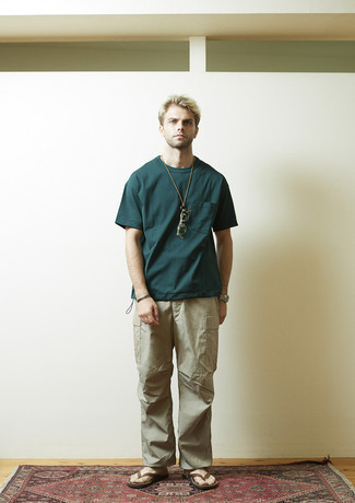 Teal Crew-neck T-shirt Outfits For Men: A teal crew-neck t-shirt and beige cargo pants are a great combination to rock at the weekend. For a more casual take, complement your ensemble with a pair of brown leather flip flops.