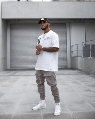 White and Red Canvas High Top Sneakers Outfits For Men: This pairing of a white print crew-neck t-shirt and grey cargo pants is hard proof that a simple casual getup can still look incredibly dapper. White and red canvas high top sneakers look great here.