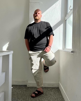 Black Canvas Sandals Outfits For Men: This dapper ensemble is easy to break down: a black crew-neck t-shirt and grey cargo pants. For a more laid-back feel, why not introduce a pair of black canvas sandals to this getup?