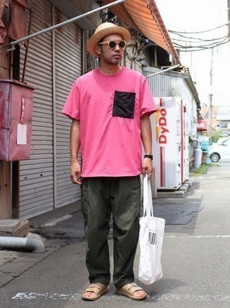 Dark Green Cargo Pants Outfits: Infuse personality into your day-to-day styling collection with a hot pink crew-neck t-shirt and dark green cargo pants. To give your look a more relaxed touch, why not complete this ensemble with tan leather sandals?