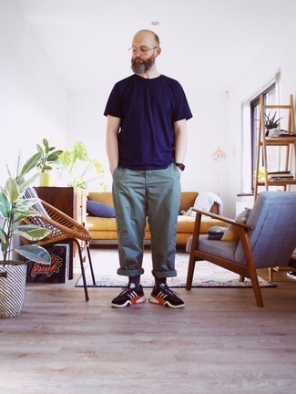 Green Chinos Outfits: To assemble an off-duty menswear style with a modern spin, try teaming a navy crew-neck t-shirt with green chinos. For a more relaxed aesthetic, why not introduce black and white athletic shoes to your ensemble?