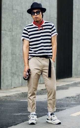 Beige Chinos Hot Weather Outfits: For a look that offers practicality and dapperness, opt for a white and navy horizontal striped crew-neck t-shirt and beige chinos. Finishing with white and navy athletic shoes is an easy way to infuse an easy-going feel into your look.