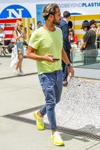 Green-Yellow Athletic Shoes Outfits For Men: Effortlessly blurring the line between sharp and laid-back, this pairing of a green-yellow crew-neck t-shirt and blue chinos will easily become one of your favorites. And if you wish to immediately dial down this look with a pair of shoes, round off with a pair of green-yellow athletic shoes.