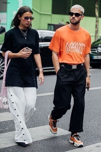 Black Canvas Belt Outfits For Men: Breathe a casual touch into your daily fashion mix with an orange print crew-neck t-shirt and a black canvas belt. Avoid looking too casual by finishing off with orange athletic shoes.