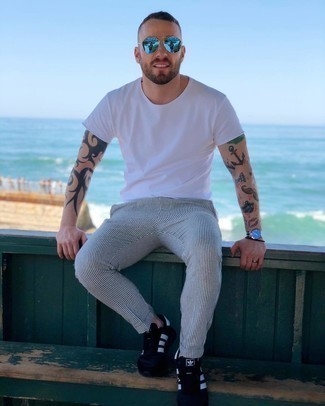 Men's White Crew-neck T-shirt, White and Navy Vertical Striped Chinos, Black and White Athletic Shoes, Aquamarine Sunglasses