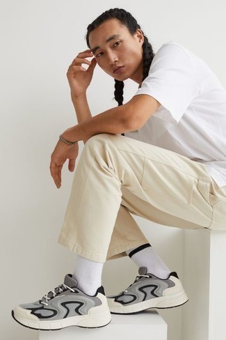 White and Black Horizontal Striped Socks Outfits For Men: A white crew-neck t-shirt and white and black horizontal striped socks are indispensable essentials if you're planning a casual closet that matches up to the highest style standards. Take your getup down a smarter path by sporting a pair of grey athletic shoes.