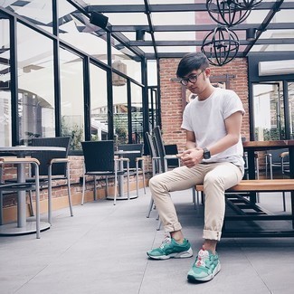 Mint Athletic Shoes Outfits For Men: A white crew-neck t-shirt and beige chinos are a combination that every dapper man should have in his casual arsenal. Finishing with mint athletic shoes is an effective way to introduce a dash of stylish casualness to this look.