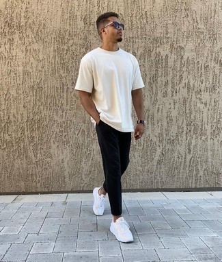 White and Black Athletic Shoes Outfits For Men: To don a casual look with a twist, make a white crew-neck t-shirt and black chinos your outfit choice. Rev up the appeal of your look by rounding off with a pair of white and black athletic shoes.