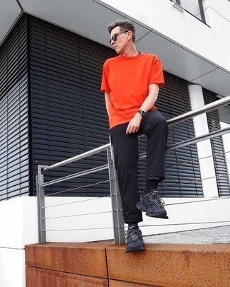Men's Orange Crew-neck T-shirt, Black Chinos, Black Athletic Shoes, Black Sunglasses