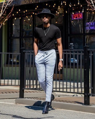 Black Crew-neck T-shirt Outfits For Men: A black crew-neck t-shirt and light blue plaid chinos married together are the ideal outfit for those who appreciate casually stylish styles. A pair of navy leather chelsea boots instantly ramps up the fashion factor of this ensemble.