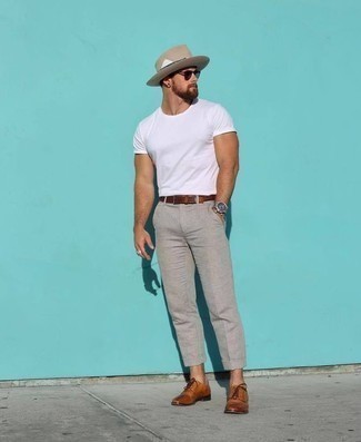 Red Leather Belt Outfits For Men: This dapper look is super straightforward: a white crew-neck t-shirt and a red leather belt. To bring a bit of flair to your getup, complement this ensemble with tobacco leather derby shoes.