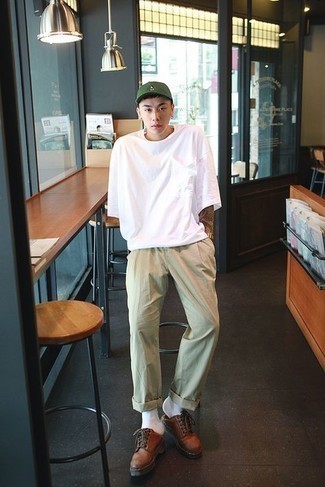 Men's White Crew-neck T-shirt, Beige Chinos, Brown Chunky Leather Derby Shoes, Dark Green Baseball Cap