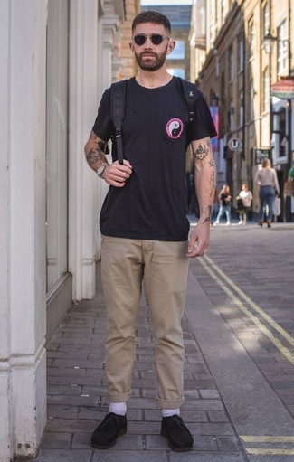 Black Suede Desert Boots Outfits: Rock a black print crew-neck t-shirt with khaki chinos to achieve an extra dapper and modern-looking casual outfit. Add black suede desert boots to the equation for an instant style lift.