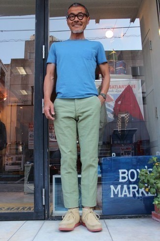 Green Chinos Outfits: This laid-back combination of a blue crew-neck t-shirt and green chinos is very easy to throw together without a second thought, helping you look awesome and ready for anything without spending too much time rummaging through your wardrobe. Put a different spin on this outfit by rocking a pair of beige suede desert boots.