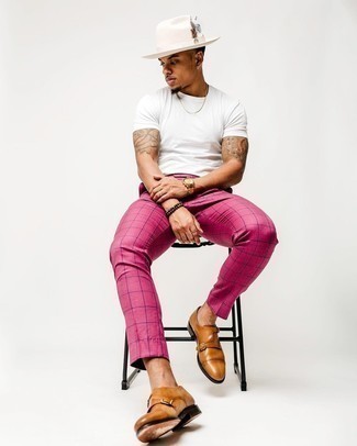 1200+ Hot Weather Outfits For Men: A white crew-neck t-shirt and hot pink chinos have become indispensable casual essentials for most guys. A pair of tan leather double monks easily bumps up the fashion factor of your ensemble.