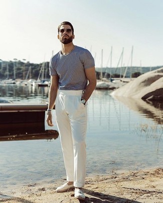 White Canvas Espadrilles Outfits For Men: We give a huge thumbs up to this casual pairing of a white and navy horizontal striped crew-neck t-shirt and white chinos! A pair of white canvas espadrilles will contrast beautifully against the rest of the outfit.