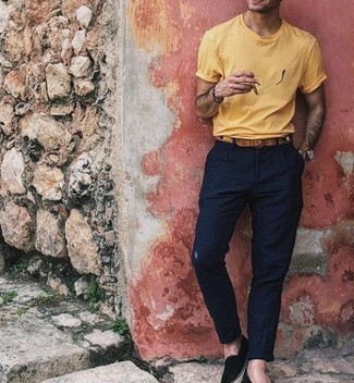 Black Canvas Espadrilles Outfits For Men: Pair a yellow crew-neck t-shirt with navy chinos to create an interesting and current relaxed casual ensemble. This look is complemented nicely with a pair of black canvas espadrilles.