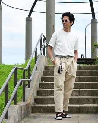 White Canvas Espadrilles Outfits For Men: This pairing of a white crew-neck t-shirt and beige chinos is irrefutable proof that a safe casual ensemble can still look really interesting. As for footwear, add white canvas espadrilles to the mix.