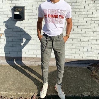 White Print Canvas High Top Sneakers Outfits For Men: Showcase your skills in menswear styling by teaming a white and red print crew-neck t-shirt and grey chinos for a casual look. A pair of white print canvas high top sneakers easily turns up the street cred of your outfit.