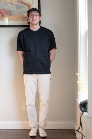 Beige Chinos Hot Weather Outfits: If you love off-duty combinations, then you'll love this combo of a black crew-neck t-shirt and beige chinos. Give a fresh twist to your look by sporting beige canvas high top sneakers.