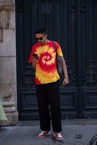 Red Tie-Dye Crew-neck T-shirt Outfits For Men: This combo of a red tie-dye crew-neck t-shirt and black chinos is perfect for off-duty situations. A pair of white and red leather high top sneakers effortlessly ramps up the appeal of your ensemble.