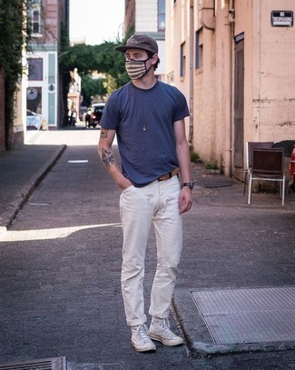 Dark Brown Baseball Cap Outfits For Men: If you're all about relaxed dressing when it comes to your personal style, you'll love this laid-back combination of a navy crew-neck t-shirt and a dark brown baseball cap. For footwear, take a more elegant route with white canvas high top sneakers.