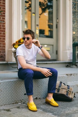 Yellow Leather Loafers Outfits For Men: Why not consider pairing a white crew-neck t-shirt with navy chinos? Both items are very comfortable and will look good together. Go ahead and complete this ensemble with yellow leather loafers for a hint of polish.