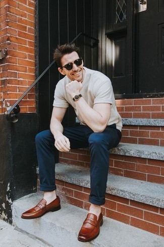 Tobacco Leather Loafers Outfits For Men: This pairing of a beige crew-neck t-shirt and navy chinos is irrefutable proof that a safe off-duty look can still look really dapper. Complete this look with tobacco leather loafers to kick things up to the next level.