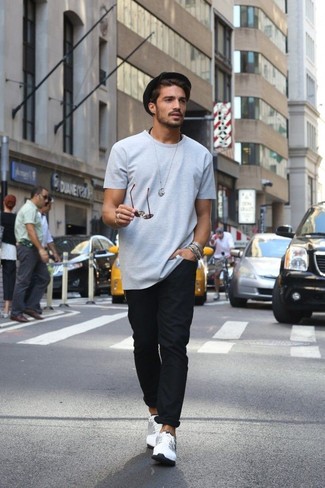 Black Chinos Hot Weather Outfits: Fashionable and practical, this laid-back combo of a grey crew-neck t-shirt and black chinos delivers variety. White low top sneakers are a great choice to complete this outfit.