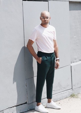 Hot Pink Crew-neck T-shirt Outfits For Men: A hot pink crew-neck t-shirt and dark green chinos are the kind of a foolproof casual ensemble that you so awfully need when you have zero time. Look at how great this look goes with a pair of white canvas low top sneakers.