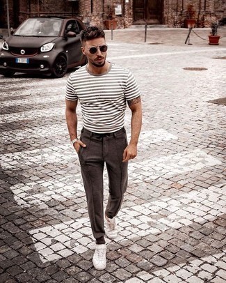 Charcoal Horizontal Striped Crew-neck T-shirt Outfits For Men: We say a big yes to this casual combination of a charcoal horizontal striped crew-neck t-shirt and brown chinos! If you're hesitant about how to round off, complement this ensemble with white canvas low top sneakers.