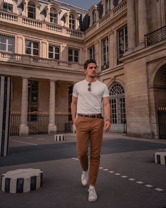 Brown Chinos Summer Outfits: A white crew-neck t-shirt and brown chinos have become veritable casual styles for most men. A nice pair of white leather low top sneakers pulls this ensemble together. Come hot summer days you want to feel fresh and stylish –– this outfit is just the right one.