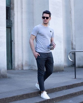 Men's Grey Print Crew-neck T-shirt, Charcoal Vertical Striped Chinos, White Canvas Low Top Sneakers, Black Sunglasses