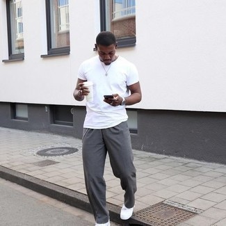 Silver Watch Hot Weather Outfits For Men: When the situation permits casual city style, make a white crew-neck t-shirt and a silver watch your outfit choice. To bring out a refined side of you, introduce a pair of white canvas low top sneakers to the equation.