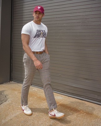 White and Red Leather Low Top Sneakers Outfits For Men: A well-executed casual combination of a white print crew-neck t-shirt and grey plaid chinos will set you apart in an instant. White and red leather low top sneakers tie the ensemble together.
