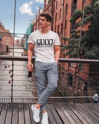 Light Blue Chinos Outfits: Go for a straightforward but at the same time casual and cool choice teaming a white and black print crew-neck t-shirt and light blue chinos. Consider white and navy canvas low top sneakers as the glue that will bring your ensemble together.
