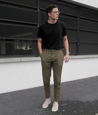 Beige Suede Low Top Sneakers Outfits For Men: For a look that's super straightforward but can be flaunted in a great deal of different ways, dress in a black crew-neck t-shirt and olive chinos. Look at how nice this look goes with a pair of beige suede low top sneakers.
