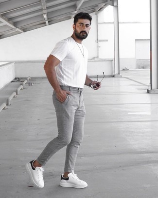 Grey Bracelet Outfits For Men: If you're looking for an edgy yet sharp getup, go for a white crew-neck t-shirt and a grey bracelet. Go the extra mile and spice up your ensemble by finishing with white and black leather low top sneakers.