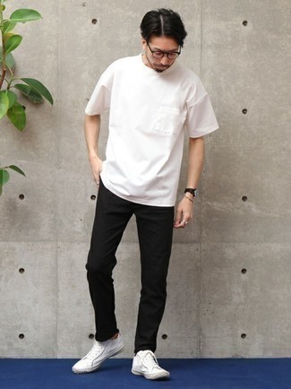 Black Chinos Summer Outfits: A white crew-neck t-shirt and black chinos matched together are a smart match. On the footwear front, this look is complemented really well with white canvas low top sneakers. This outfit is the definition of ideal for hot summer afternoons.