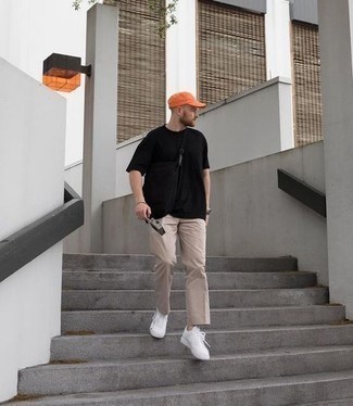 Mustard Baseball Cap Outfits For Men: A black crew-neck t-shirt and a mustard baseball cap are great menswear staples that will integrate really well within your day-to-day styling arsenal. Amp up the cool of this look by wearing white canvas low top sneakers.