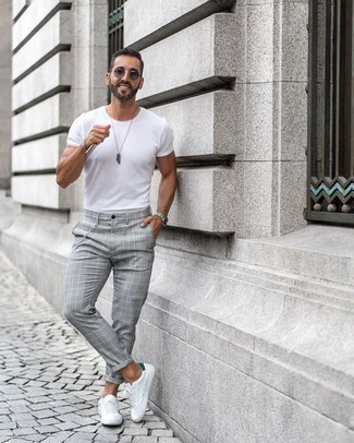Grey Plaid Chinos Outfits: A white crew-neck t-shirt and grey plaid chinos are the ideal way to introduce effortless cool into your daily casual fashion mix. Let your expert styling truly shine by rounding off this outfit with white and green leather low top sneakers.